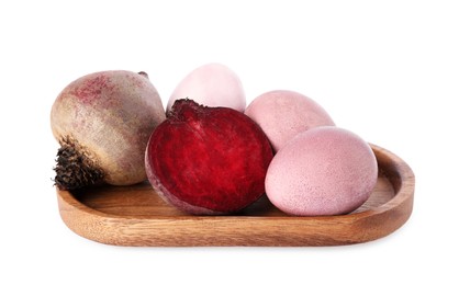 Photo of Colorful Easter eggs painted with natural dye and beets on white background