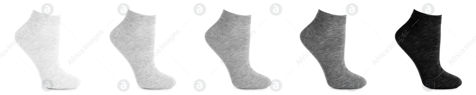 Image of Set with different socks on white background. Banner design