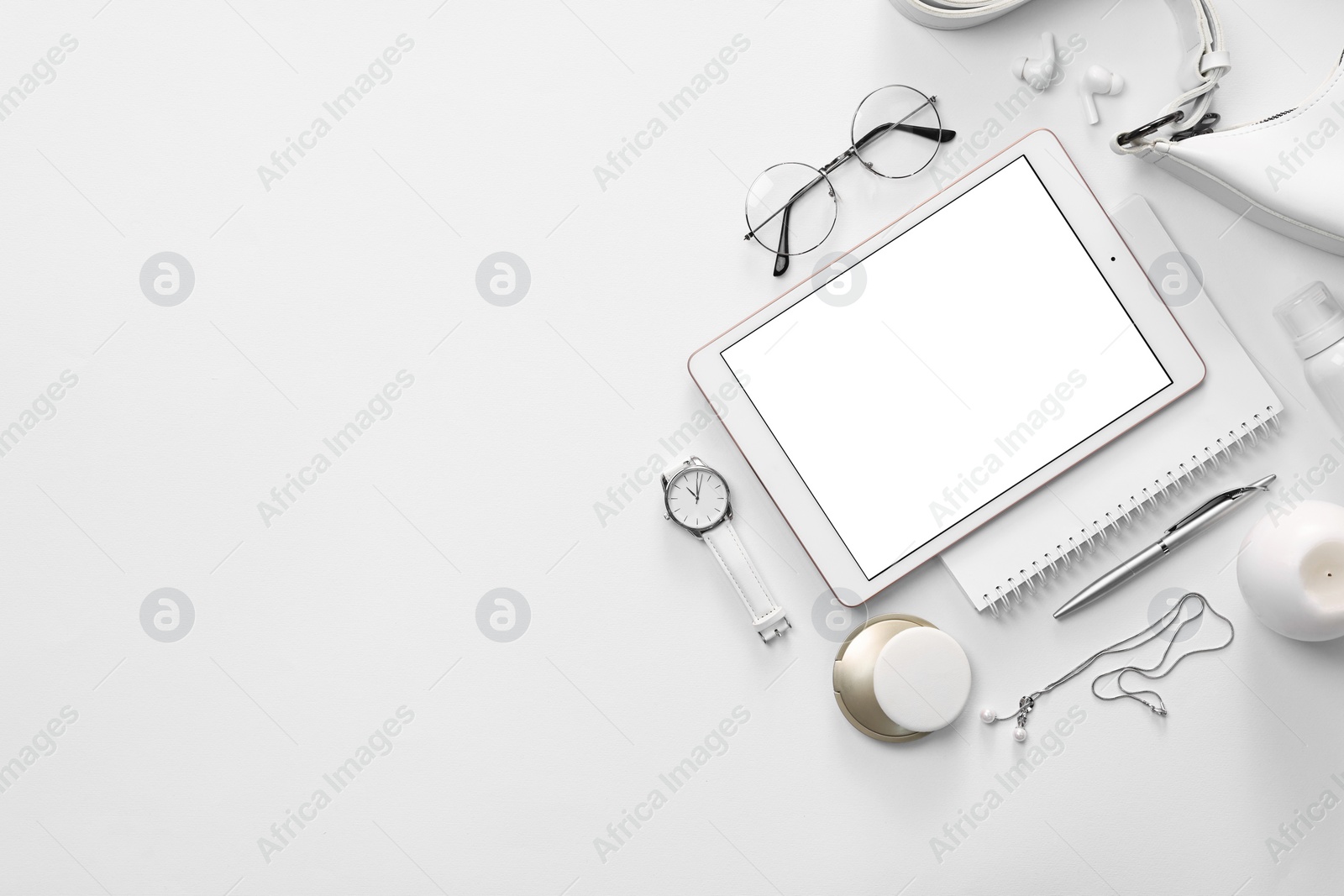 Photo of Flat lay composition with modern tablet on white background. Space for text