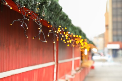 Christmas fair stall with string lights outdoors