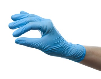 Photo of Doctor wearing light blue medical glove holding something on white background, closeup