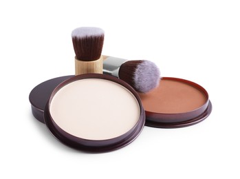 Photo of Face powders and brushes isolated on white