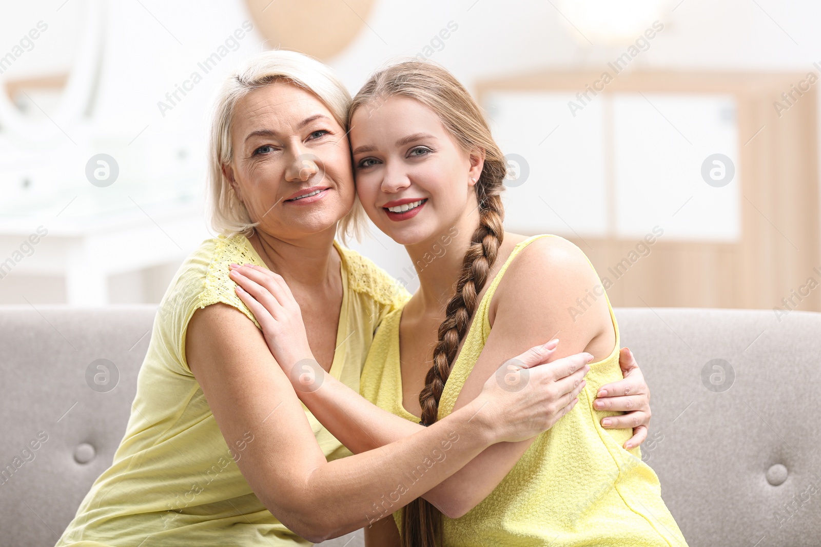 Photo of Mother and her adult daughter spending time together at home