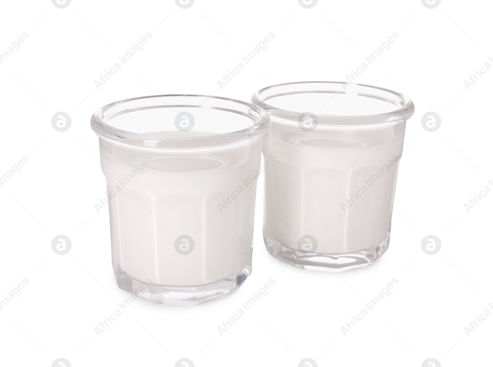 Photo of Glasses of tasty milk isolated on white