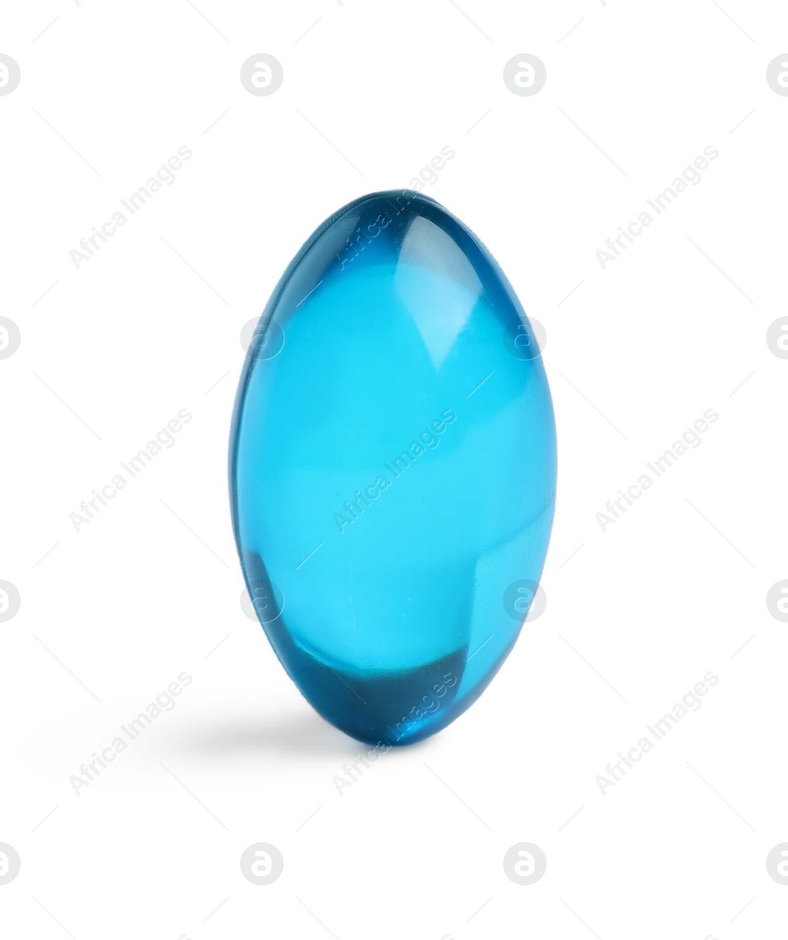 Photo of One light blue pill on white background. Medicinal treatment