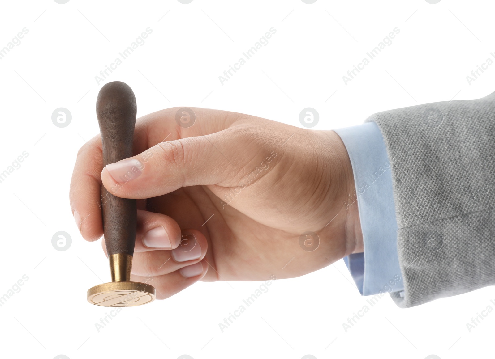 Photo of Man holding wooden stamp on white background, closeup