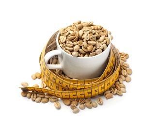 Photo of Cup with green coffee beans and measuring tape on white background