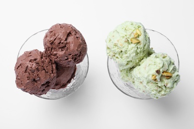 Delicious chocolate and pistachio ice creams on white background, flat lay