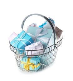 Shopping basket full of gift boxes on white background