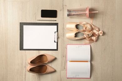 Flat lay composition with business items and art accessories on wooden background. Concept of balance between work and life