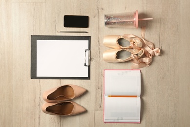 Photo of Flat lay composition with business items and art accessories on wooden background. Concept of balance between work and life