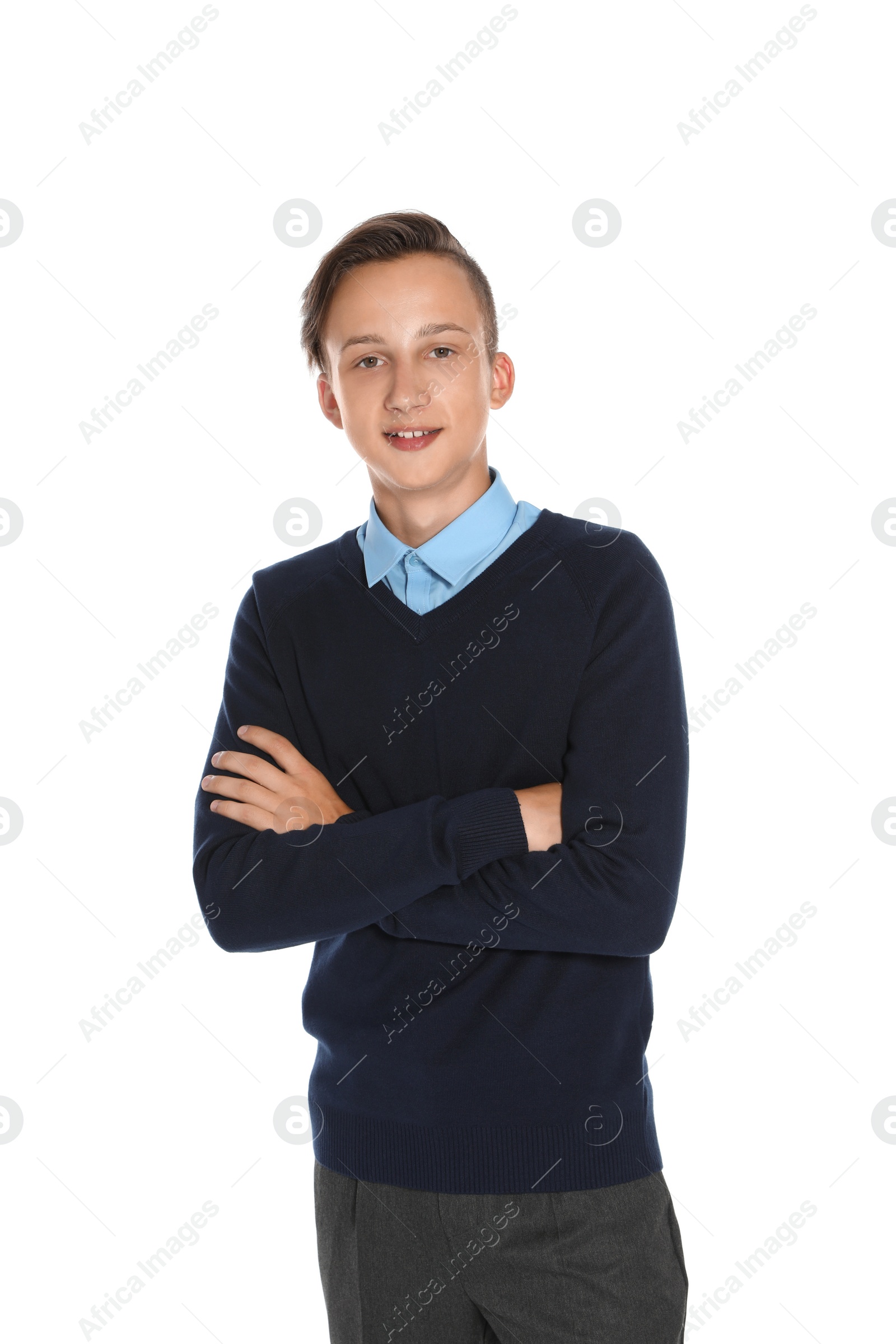 Photo of Teenage boy in stylish school uniform on white background