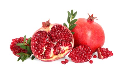 Fresh pomegranates and branches isolated on white