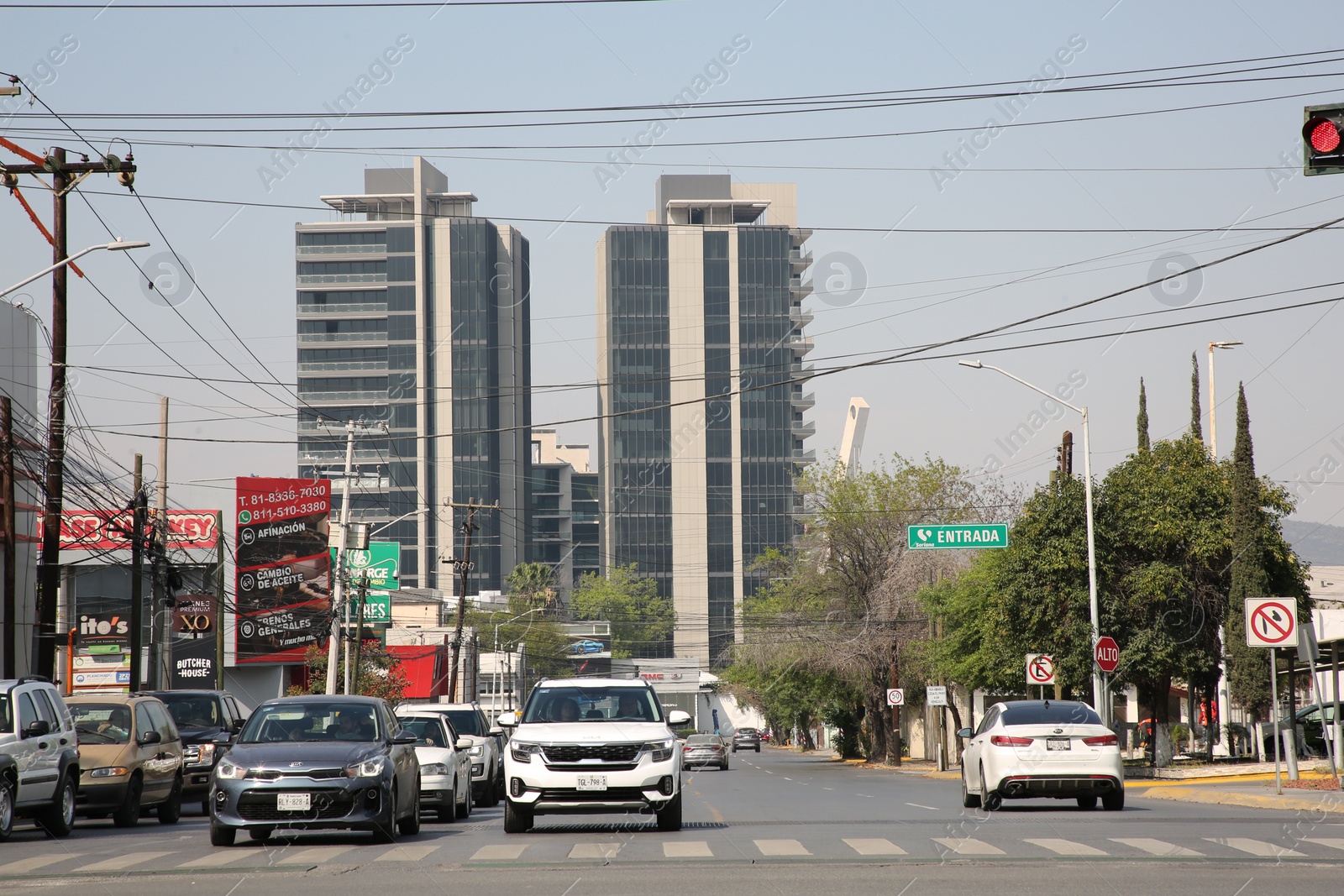 Photo of San Pedro Garza Garcia, Mexico – March 20, 2023: Beautiful view of city street with road, cars and buildings