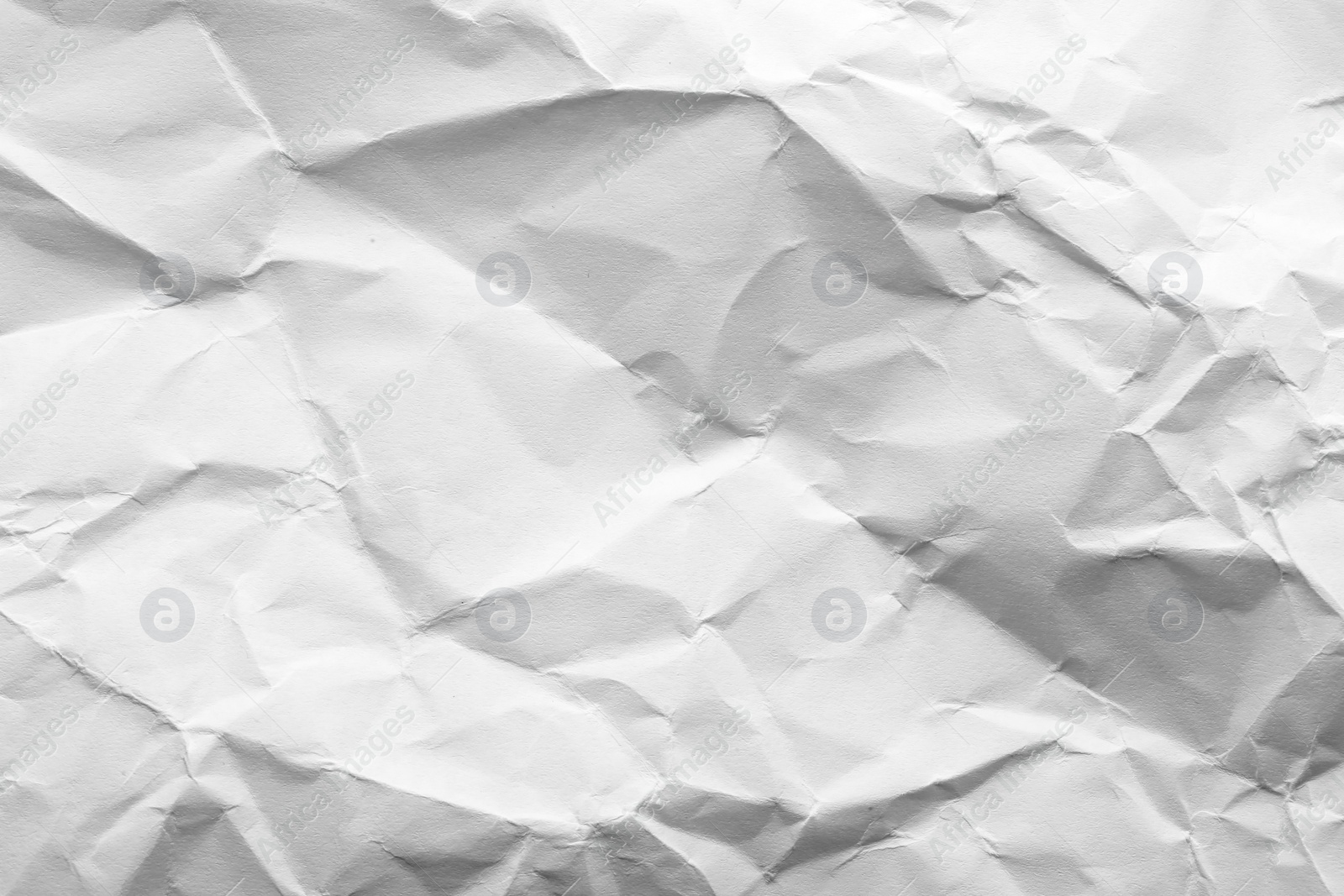 Photo of Sheet of crumpled paper as background. Space for design