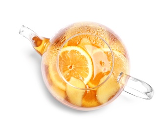 Teapot with lemon ginger tea on white background, top view