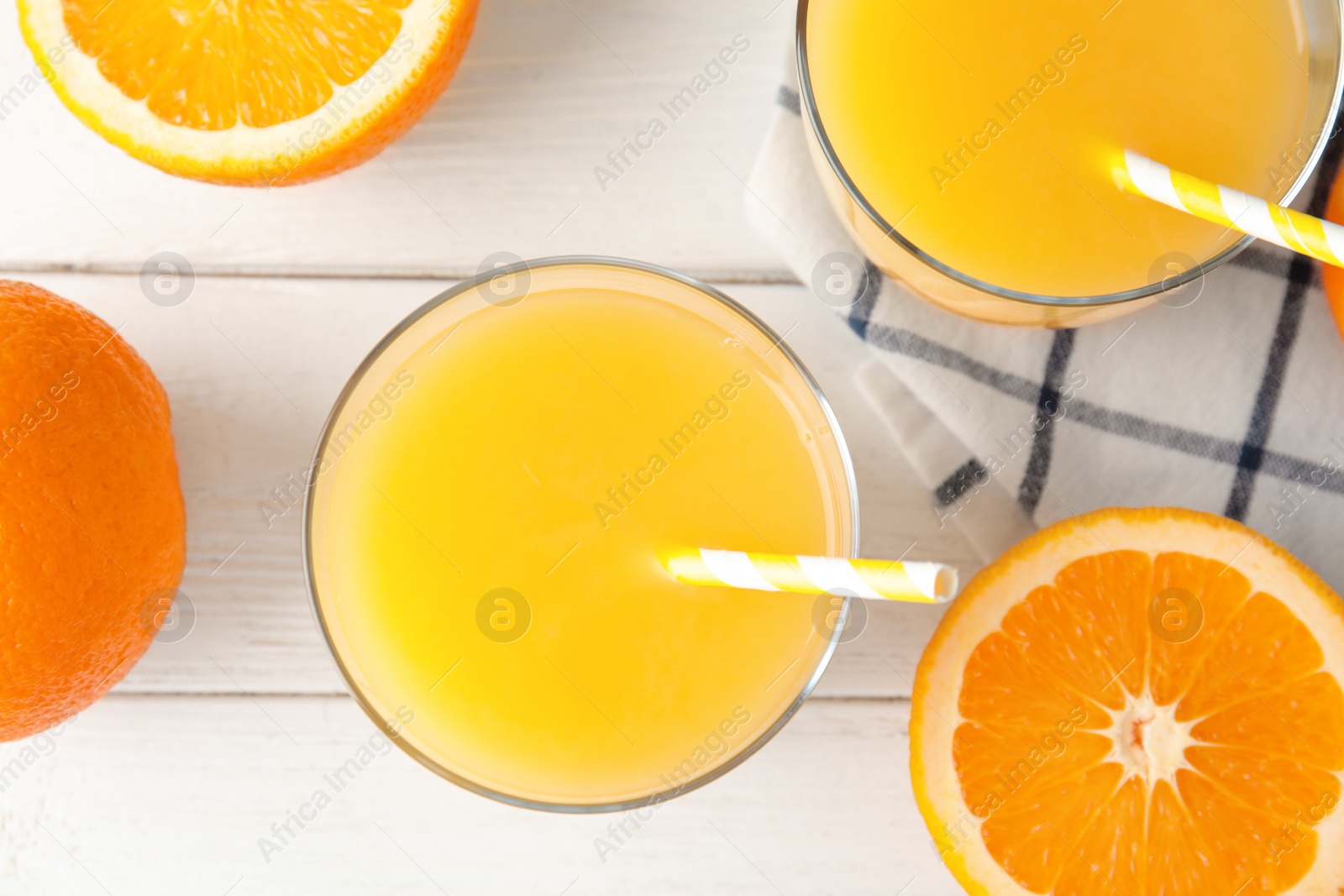 Photo of Flat lay composition with fresh orange juice on wooden background