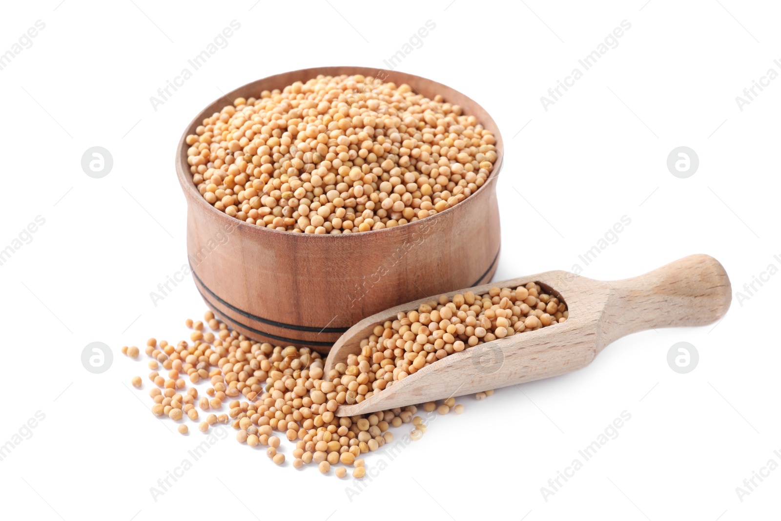 Photo of Mustard seeds with wooden bowl and scoop isolated on white