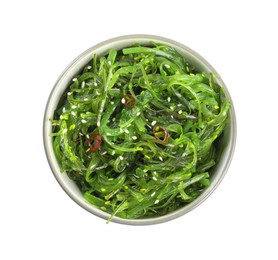 Photo of Japanese seaweed salad in bowl isolated on white, top view