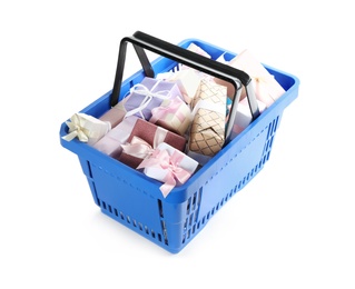 Blue shopping basket with different gifts on white background