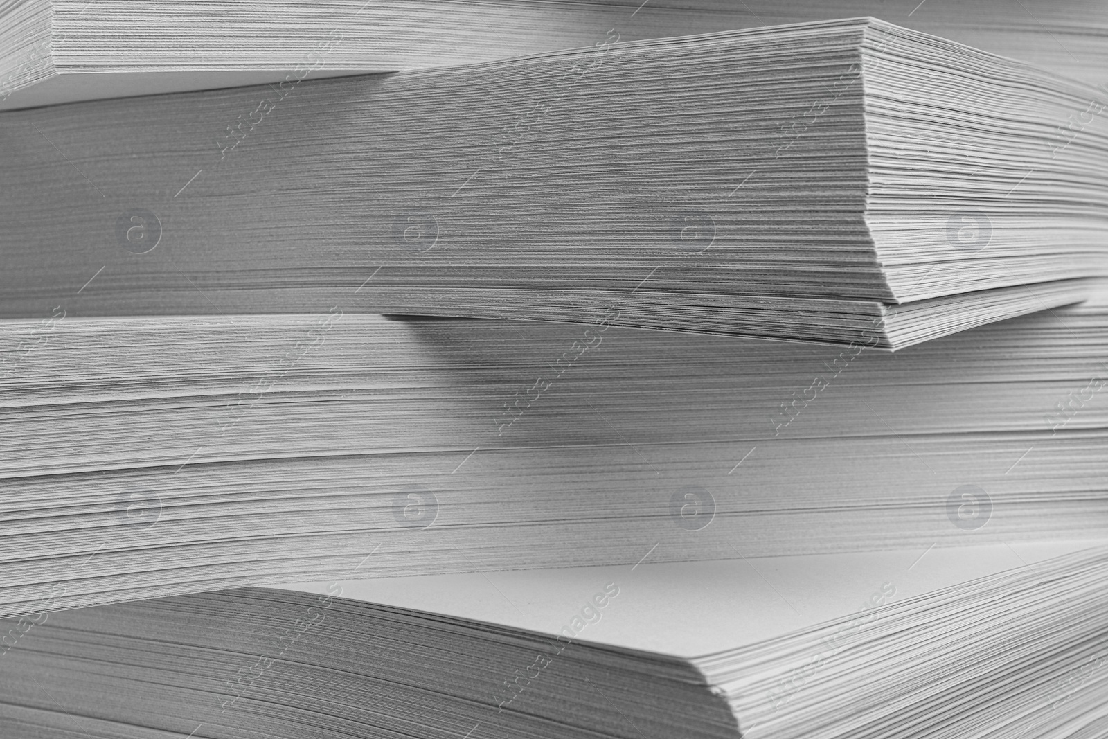 Photo of Stack of white paper sheets, closeup view