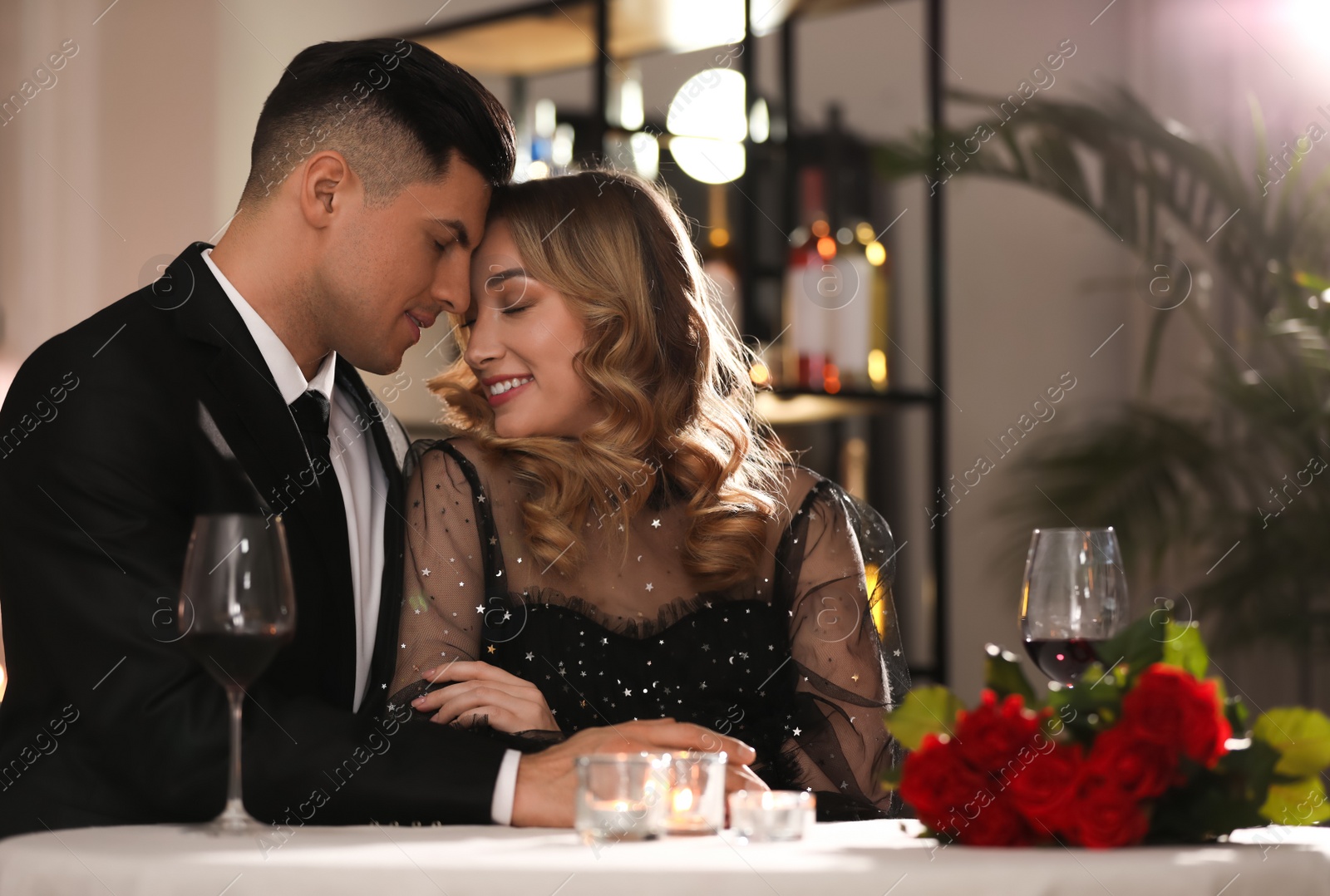 Photo of Lovely couple having romantic dinner on Valentine's day in restaurant