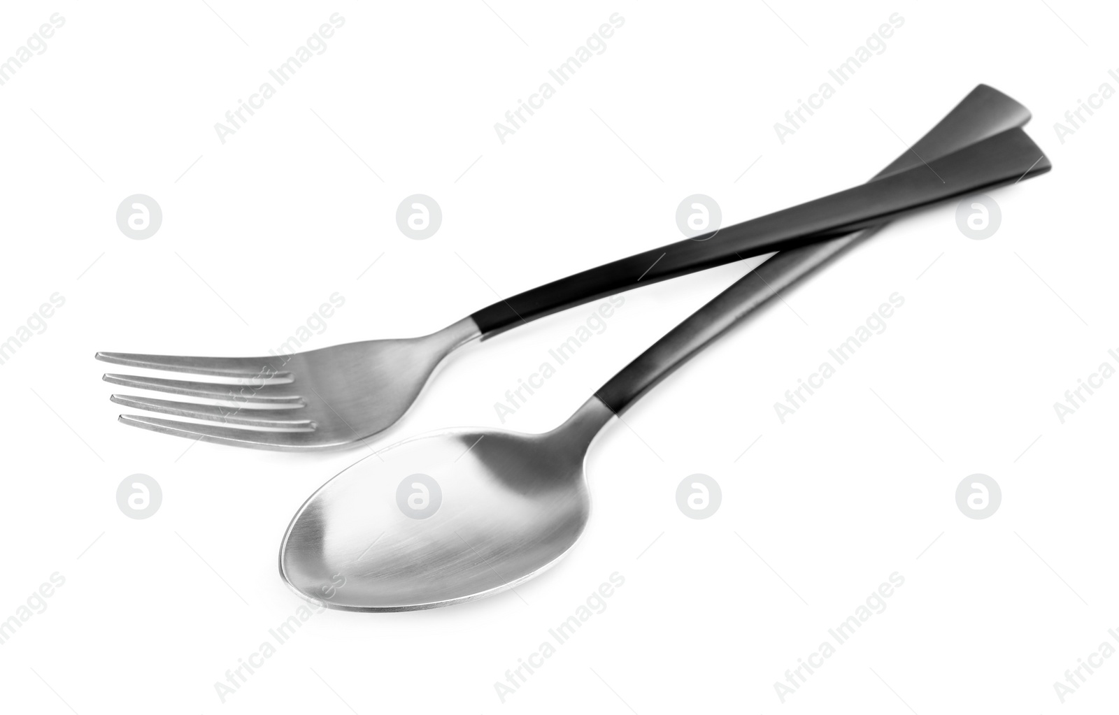 Photo of New fork and spoon with black handles on white background