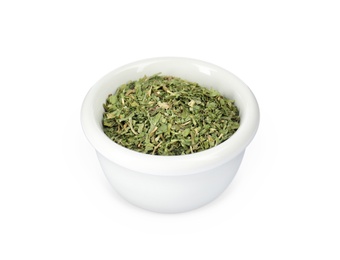 Dry parsley in ceramic bowl on white background