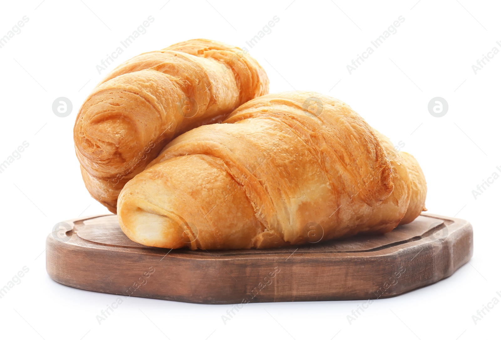 Photo of Wooden board with tasty croissants on white background