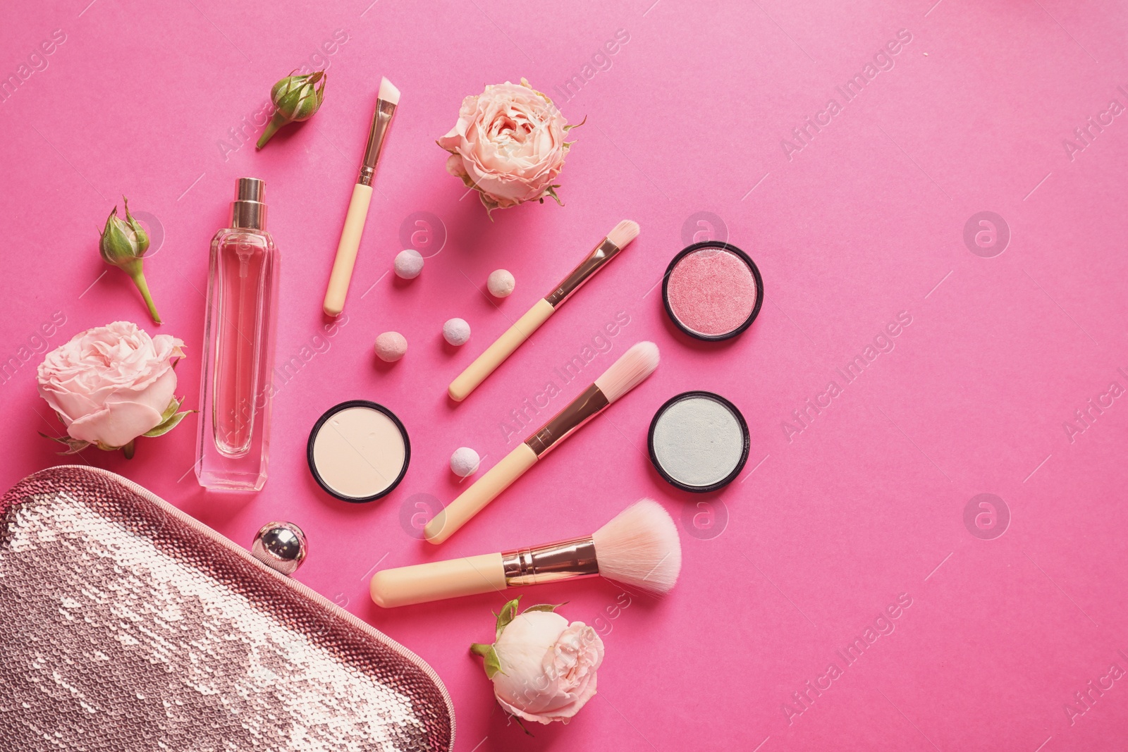 Photo of Flat lay composition with products for decorative makeup on pink background