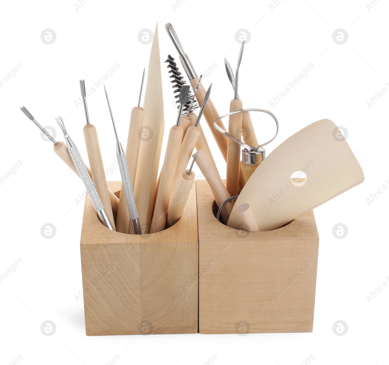Photo of Set of different clay crafting tools in holder isolated on white