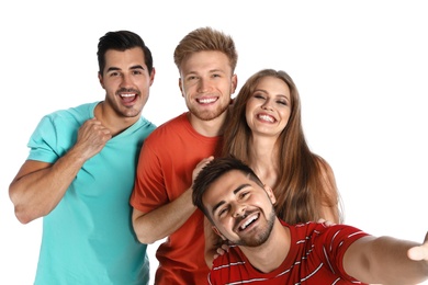 Happy young people taking selfie on white background