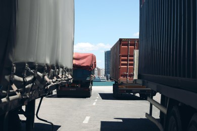 Photo of Many cargo trucks on pier in sea port