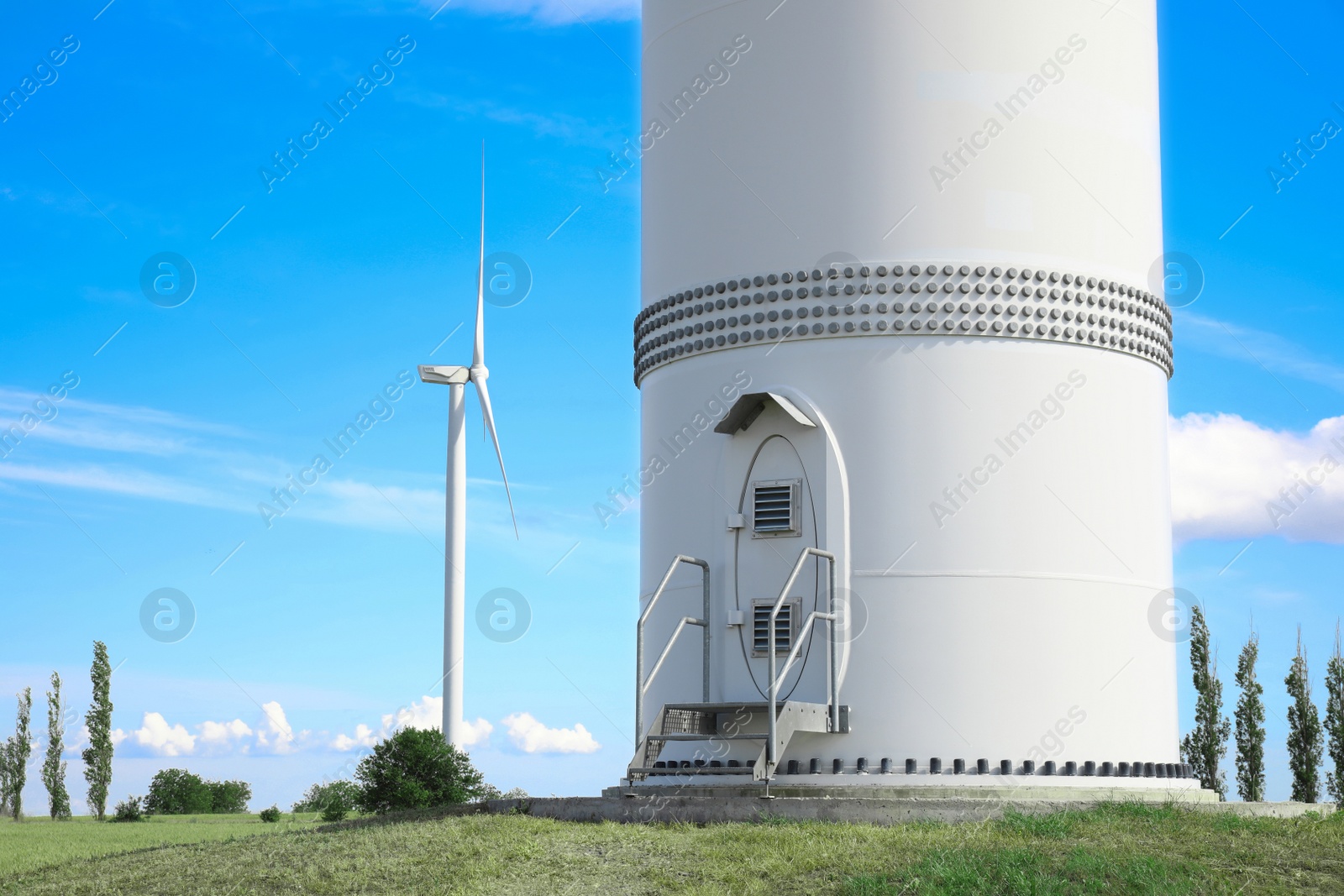 Photo of Entrance to wind turbine power generator outdoors. Alternative energy source