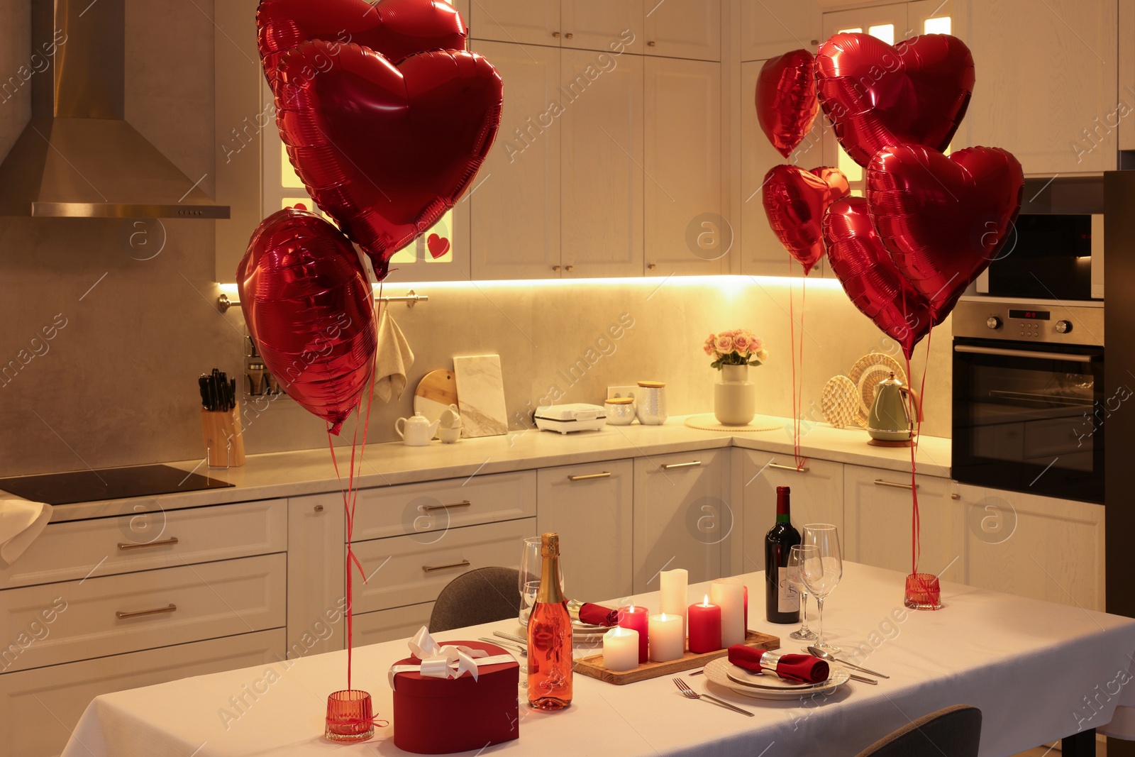 Photo of Romantic atmosphere. Cosy kitchen with set table decorated for Valentine day