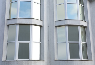 Modern office building with tinted windows. Urban architecture