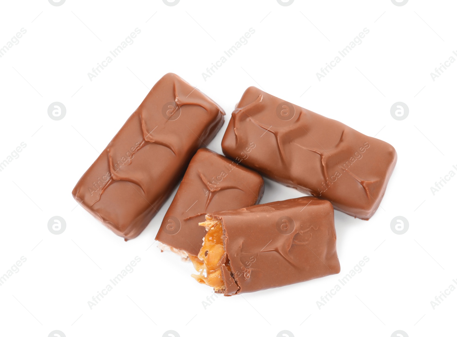 Photo of Chocolate bars with caramel, nuts and nougat isolated on white, top view