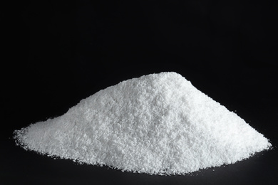 Photo of Heap of white snow on black background