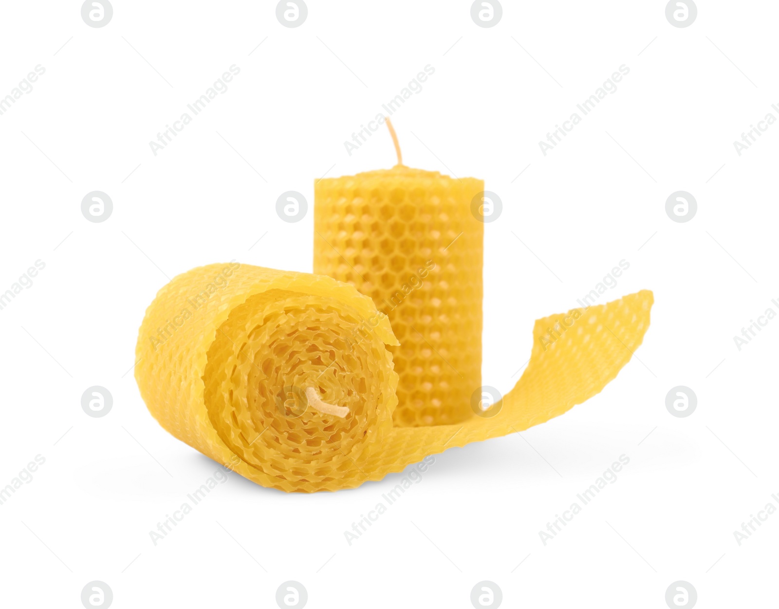 Photo of Stylish elegant beeswax candles isolated on white