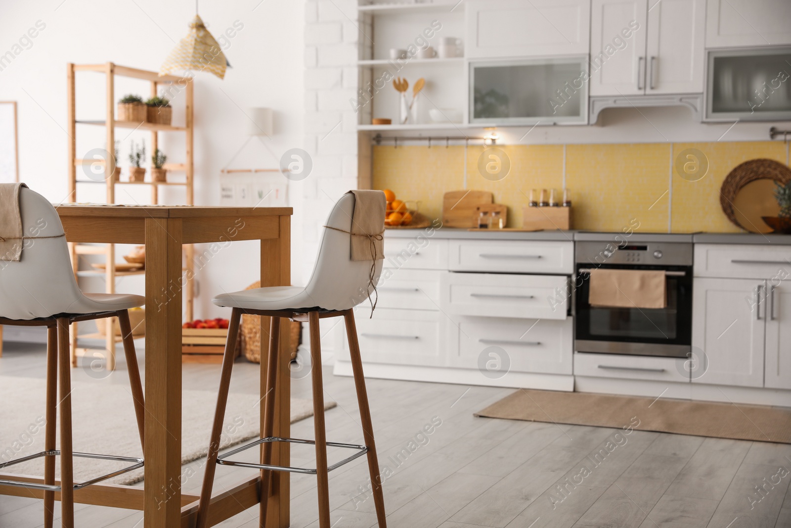 Photo of Modern kitchen interior with stylish wooden table