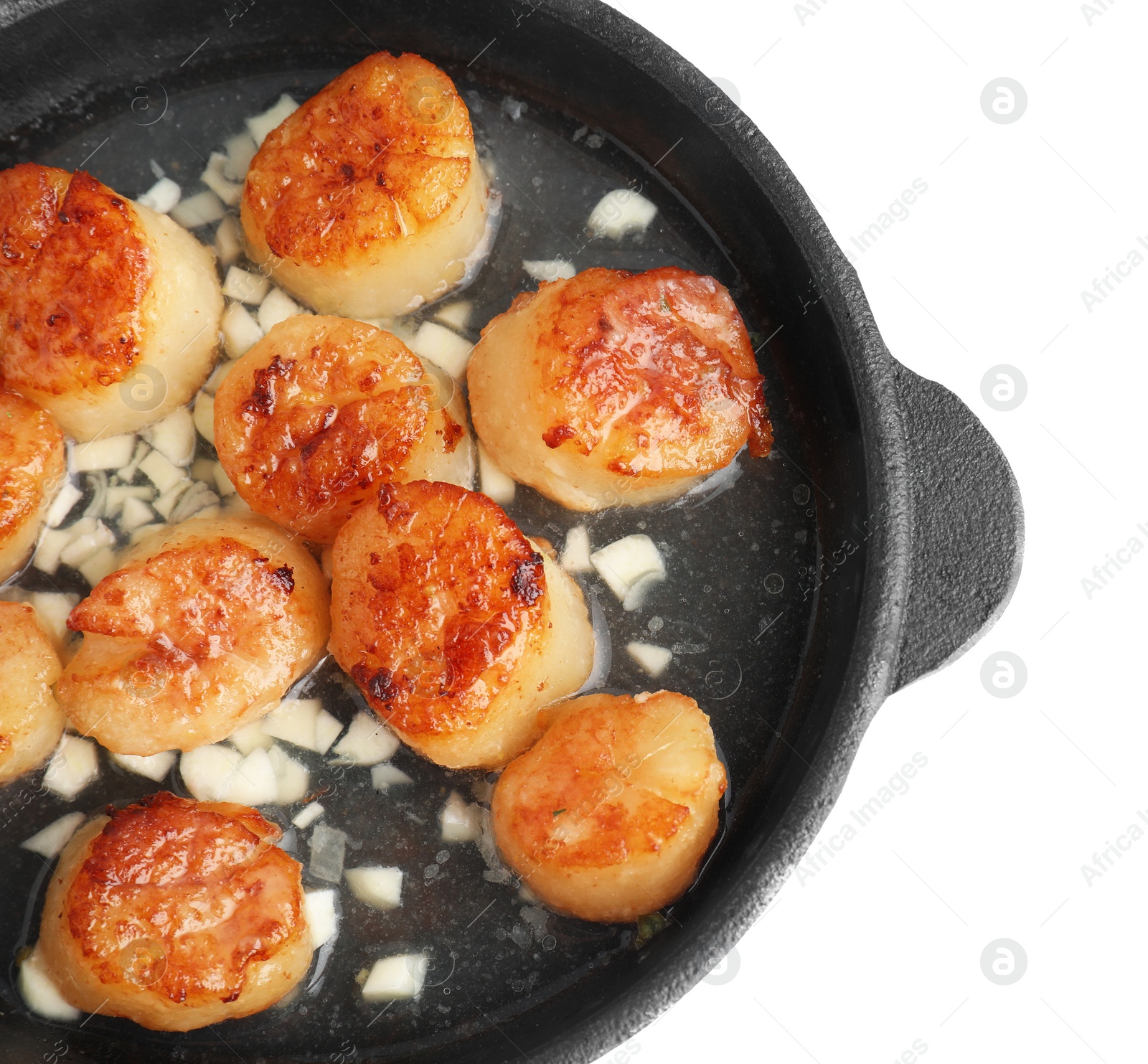 Photo of Delicious fried scallops in pan isolated on white, top view