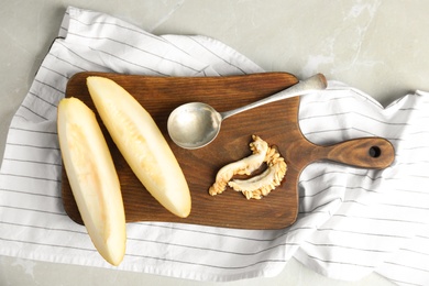 Photo of Flat lay composition with ripe melon on grey marble table