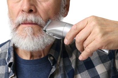 Photo of Man trimming mustache on white background, closeup