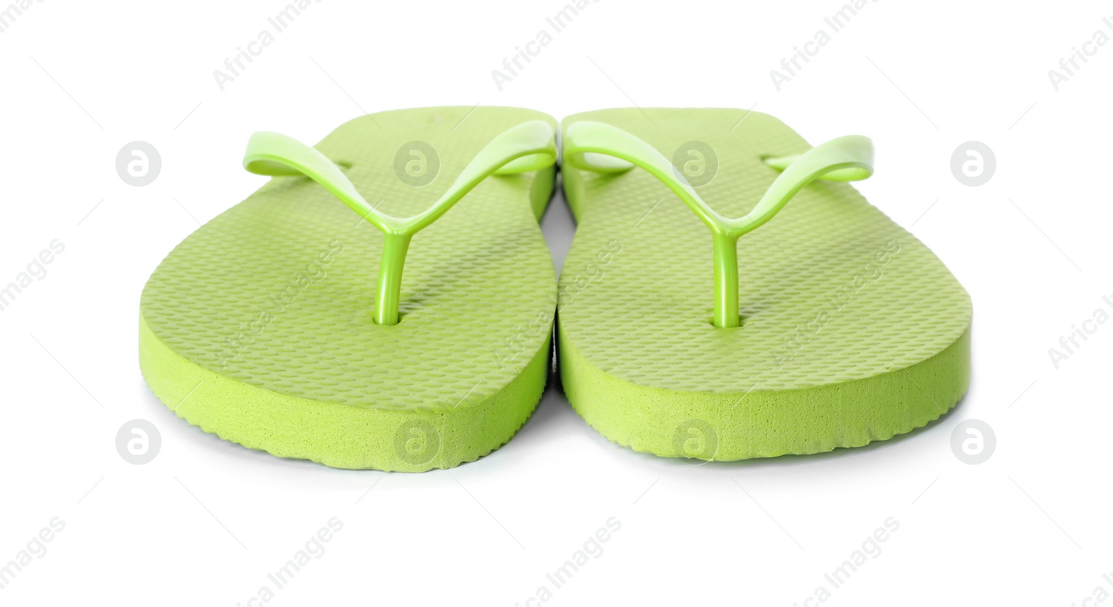 Photo of Bright flip flops on white background. Beach object