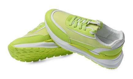 Pair of stylish light green sneakers on white background