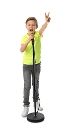 Photo of Cute boy singing in microphone on white background