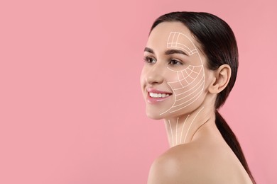 Attractive woman with perfect skin after cosmetic treatment on pink background, space for text. Lifting arrows on her face