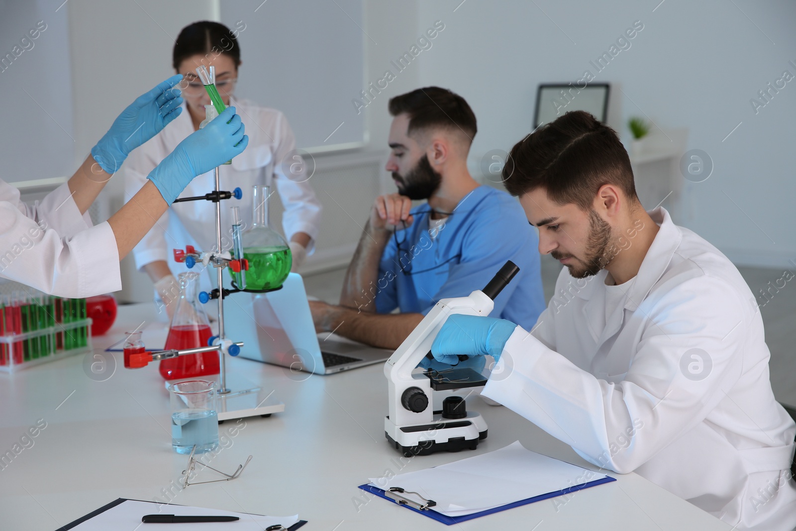 Photo of Medical students working in modern scientific laboratory