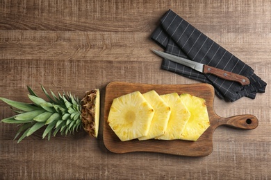 Cut fresh pineapple on wooden board