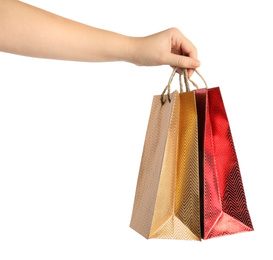 Photo of Woman holding paper shopping bags on white background, closeup